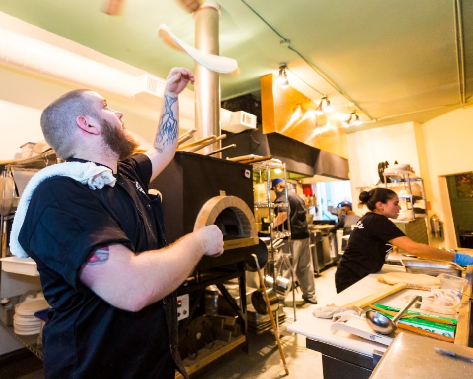 <strong>Chef Ben Wilson hand tosses pizza dough in the kitchen of Tamboli's Pasta &amp; Pizza at 1761 Madison on Oct. 30 2019.</strong> (Ziggy Mack/Special to Daily Memphian)