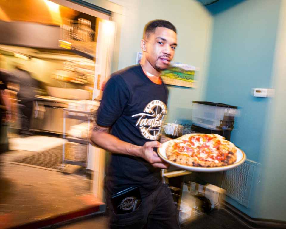 <strong>Daron Boyce leaves the kitchen with a hot meatboard pizza.</strong> (Ziggy Mack/Special to Daily Memphian)