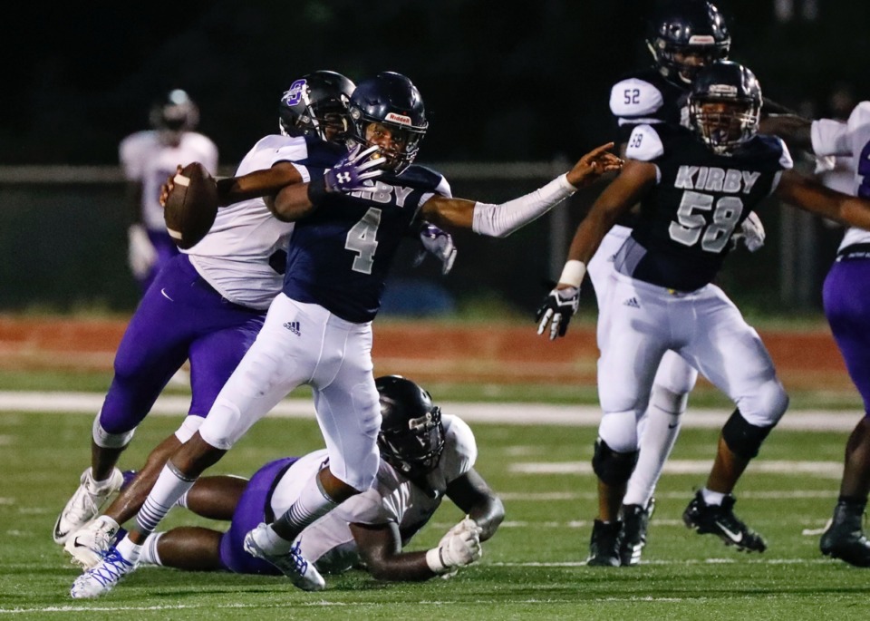 <strong>Kirby quarterback Draylen Ellis (4), seen here getting the worst of it from Southwind Sept. 20, is the statistical leader in passing yards per game, total passing yards and passing touchdowns.</strong> (Mark Weber/Daily Memphian)