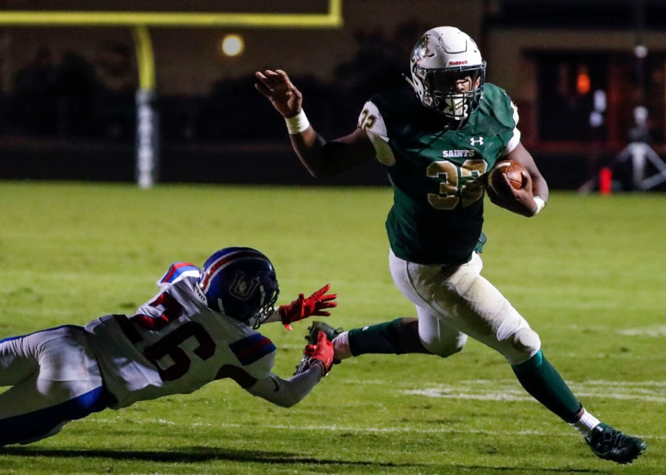 <strong>Briarcrest running back Marlon Hampton (with ball) scrambles past MUS defender Hunter Barnes (left) for a touchdown Nov. 1.</strong> (Mark Weber/Daily Memphian)