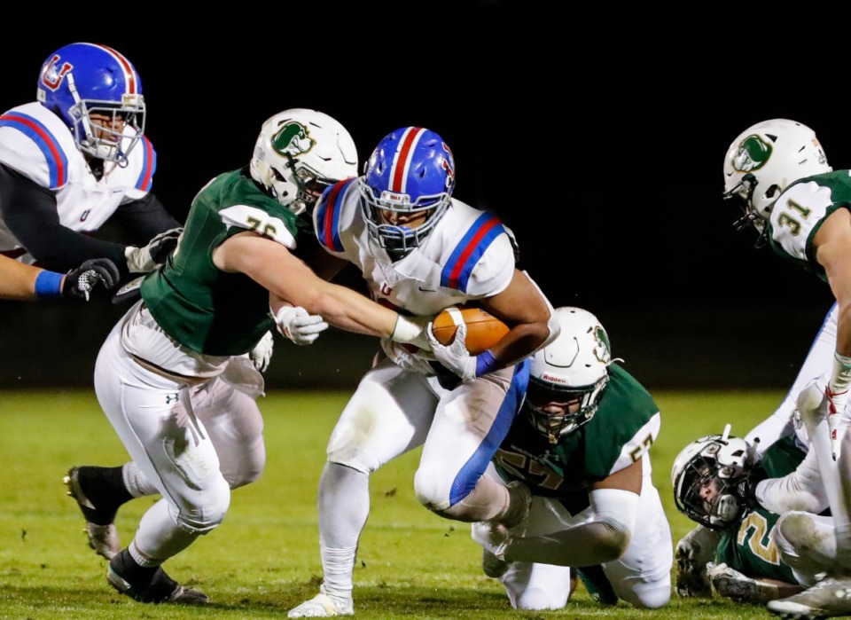 <strong>MUS running back Hunter Kendall (with ball) rushes in the game against Briarcrest Nov. 1.</strong> (Mark Weber/Daily Memphian)