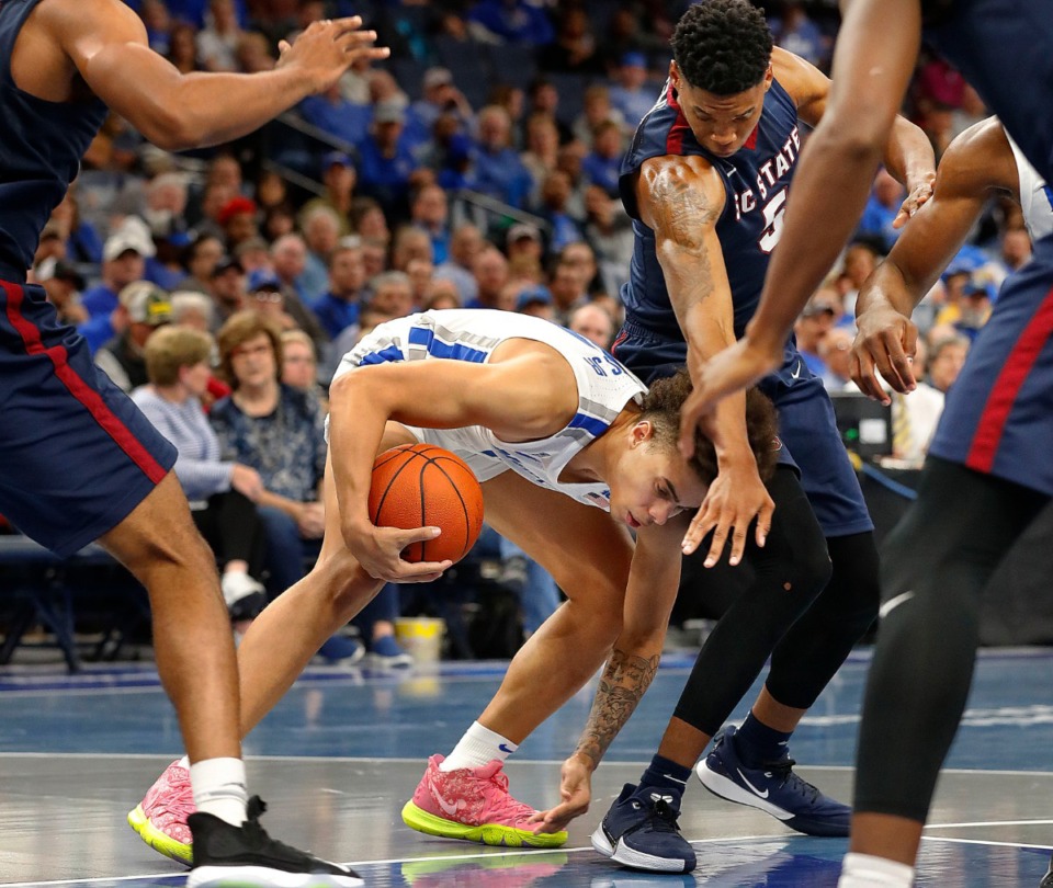 <strong>Guard Lester Quinones (with ball) scoops up a loose ball against South Carolina State Nov. 5 at FedExForum.</strong> (Mark Weber/Daily Memphian)