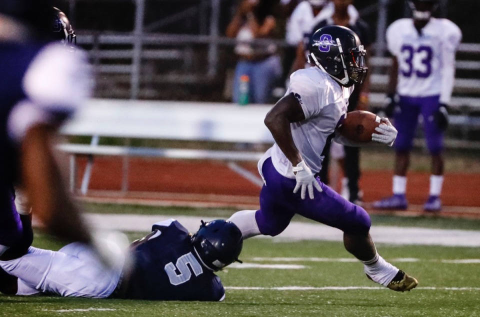 <strong>Southwind running back Romal Webb (right) runs by Kirby defender Tamarious Brown (left) Sept. 20.</strong>&nbsp;<strong>Webb had the most touchdowns in the regular season with 27.</strong> (Mark Weber/Daily Memphian)