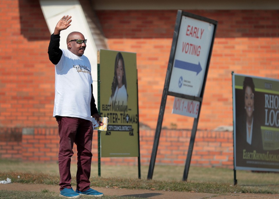 <strong>Earl Johnson tries to lure traffic on Summer Avenue for early voting in the two Memphis City Council runoff races with a wave and a smile at Berclair Church of Christ on Nov. 5, 2019.</strong> (Jim Weber/Daily Memphian)