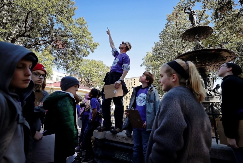 <strong>History teacher Kenneth Read talks to students from Westminster Academy about Court Square as he stands on Hebe Fountain during a class outing on Nov. 1. The fountain is one of the few landmarks from the 1870s &mdash;&nbsp;Memphis' most challenging decade &mdash;&nbsp;that is still standing.</strong> (Jim Weber/Daily Memphian)