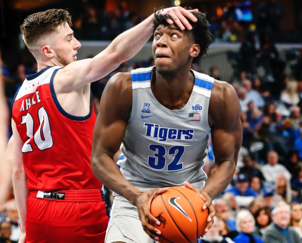 <strong>Memphis center James Wiseman (right) is knocked in the head by UIC's Jamie Ahale Nov. 8 at FedExForum.</strong> (Mark Weber/Daily Memphian)