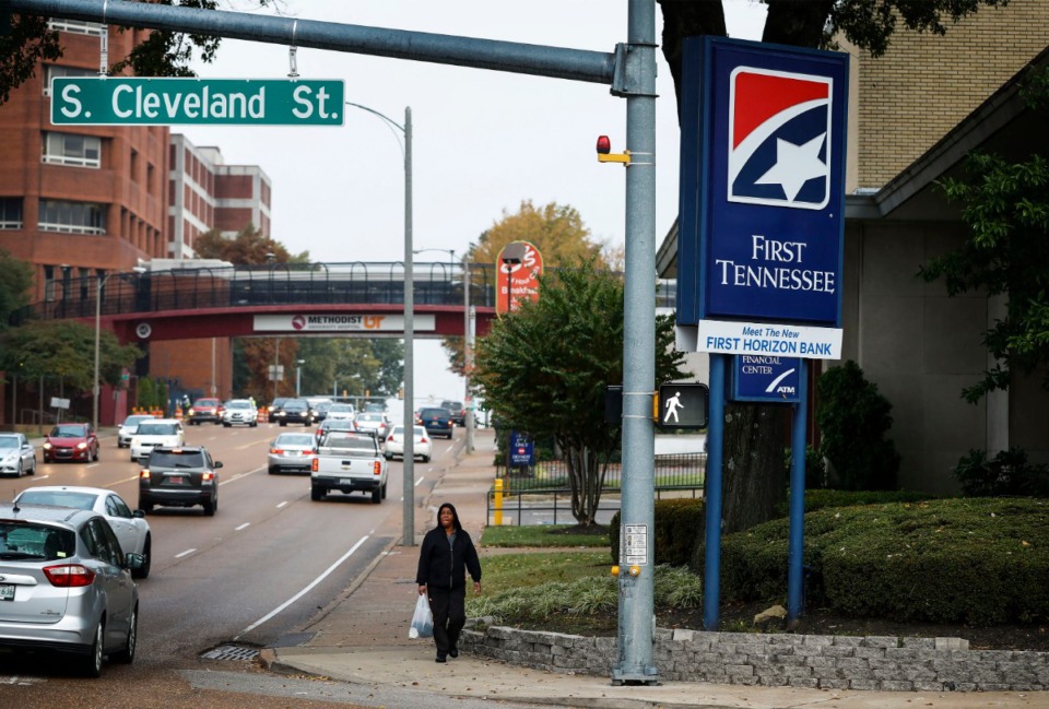 <strong>A pedestrian walks by the First Tennessee Bank on Union Avenue on Nov. 6, 2019. First Tennessee Banks will transition to the First Horizon brand, which announced plans Nov. 4 for an all-stock merger of equals with Iberiabank that would create a $75 billion asset super-regional bank.</strong> (Mark Weber/Daily Memphian)