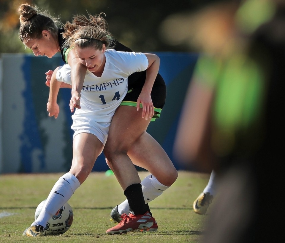 <strong>University of Memphis midfielder Claire Abrey (14) gets tangled up with USF forward Sabrina Wagner during the Tiger's game against USF in the AAC Women's Championship final at the Billy J. Murphy Soccer and Track Complex on Nov. 10, 2019.</strong> (Jim Weber/Daily Memphian)