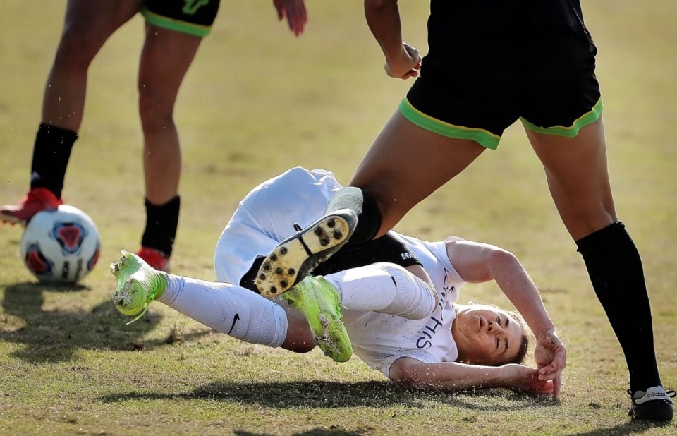 <strong>University of Memphis forward Lisa Pechersky is tripped up by USF defender Aubrey Megrath during the Tiger's game against USF in the AAC Women's Championship final at the Billy J. Murphy Soccer and Track Complex on Nov. 10, 2019.</strong> (Jim Weber/Daily Memphian)
