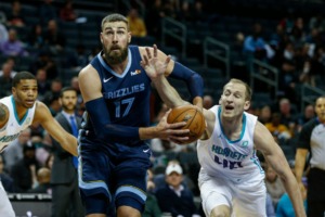 <strong>Charlotte Hornets center Cody Zeller, right, reaches in to strip the ball from Memphis Grizzlies center Jonas Valanciunas in the first half of an NBA basketball game in Charlotte, N.C., Nov. 13.</strong> (Nell Redmond/AP)