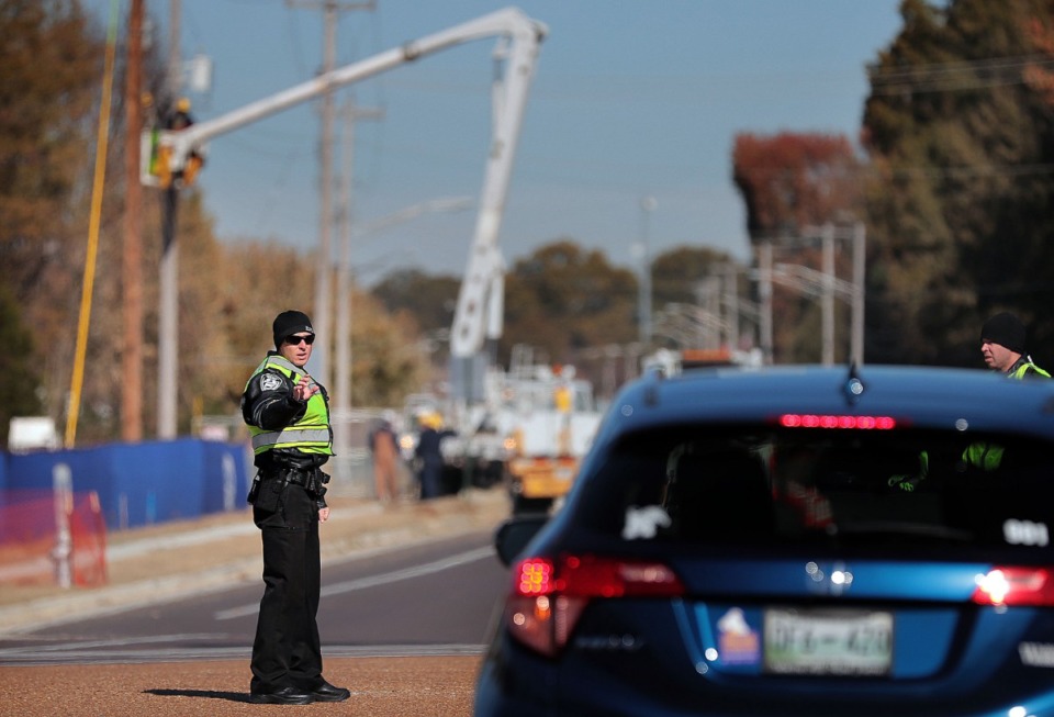 <strong>Bartlett police officers direct traffic at Appling Road and Brother Boulevard on Wednesday, Nov. 13. The stoplight at the intersection was down&nbsp;because of utility work at the new TCAT facility that&rsquo;s under construction.</strong> (Jim Weber/Daily Memphian)