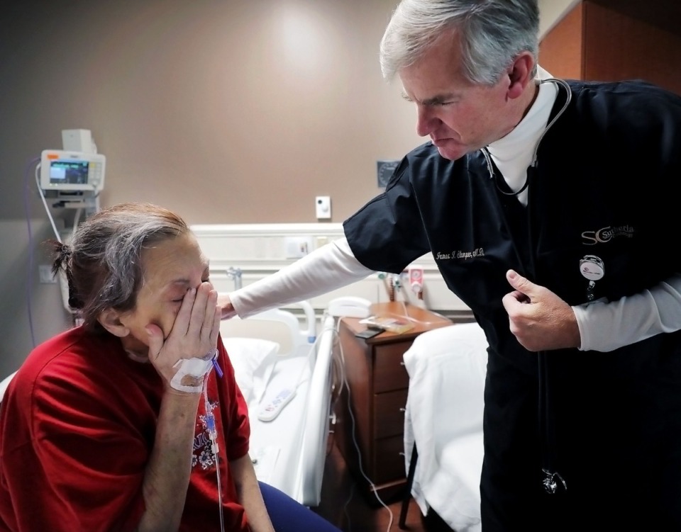 <strong>Dr. James Stamper comforts his longtime patient Rosalind Black on Oct. 31, 2019, while she describes the joy and mobility her Aquapheresis treatment at Methodist North has afforded her.</strong> (Patrick Lantrip/Daily Memphian)