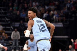 <strong>Memphis guard Ja Morant looks back and smiles after a dunk against the Utah Jazz Nov. 15 at FedExForum.</strong> (Karen Pulfer Focht/AP)