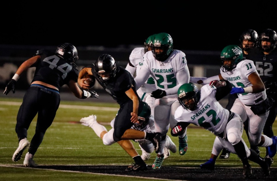 <strong>Houston running back Lincoln Pare (with ball) rushes past White Station Nov. 15.</strong> (Mark Weber/Daily Memphian)