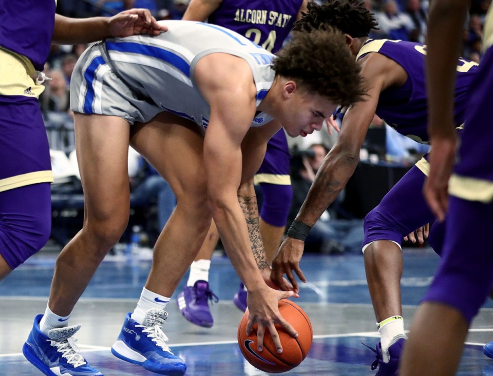 <strong>University of Memphis guard Lester Quinones (11) fights for a loose ball during a home win against Alcorn State University at FedExForum on Nov. 16, 2019.</strong> (Patrick Lantrip/Daily Memphian)