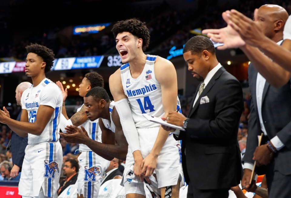 <strong>Memphis forward Isaiah Maurice (middle) cheers with his teammates on the bench i the game against Little Rock Nov. 20 at FedExForum.</strong> (Mark Weber/Daily Memphian)