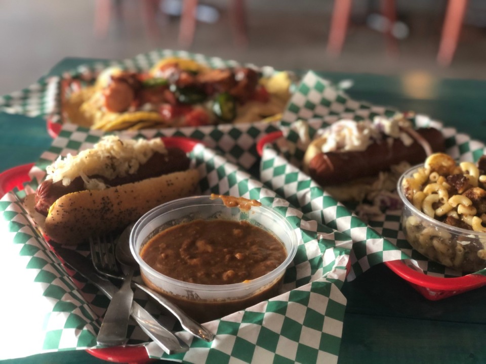 <strong>Doghouzz lets you top your hot dogs as you choose and the mac and cheese shown on the right is just dog-gone delicious.</strong> (Jennifer Biggs/Daily Memphian)