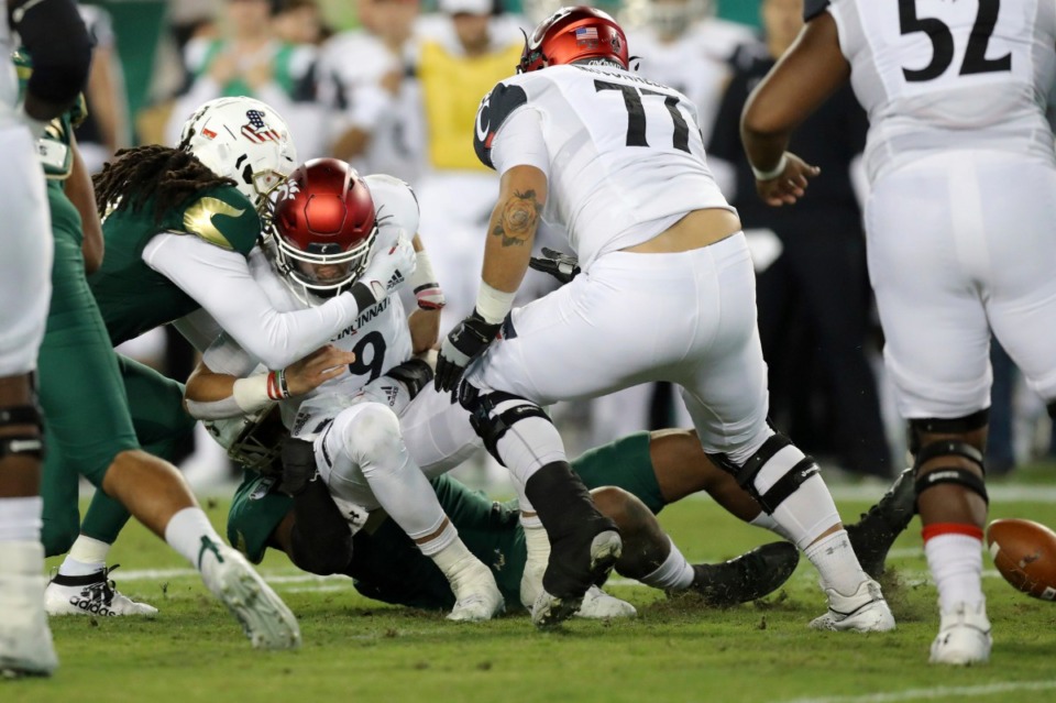 <strong>Cincinnati quarterback Desmond Ridder fumbles as he's sacked by South Florida's Dwayne Boyles during the first half of an NCAA college football game, Saturday, Nov. 16, in Tampa, Fla. The Memphis Tigers hope&nbsp;<span class="s1">to extend their winning streak to five games on Saturday when they face South Florida</span></strong><span class="s1"><strong>.</strong>&nbsp;</span>(Mike Carlson/Associated Press)