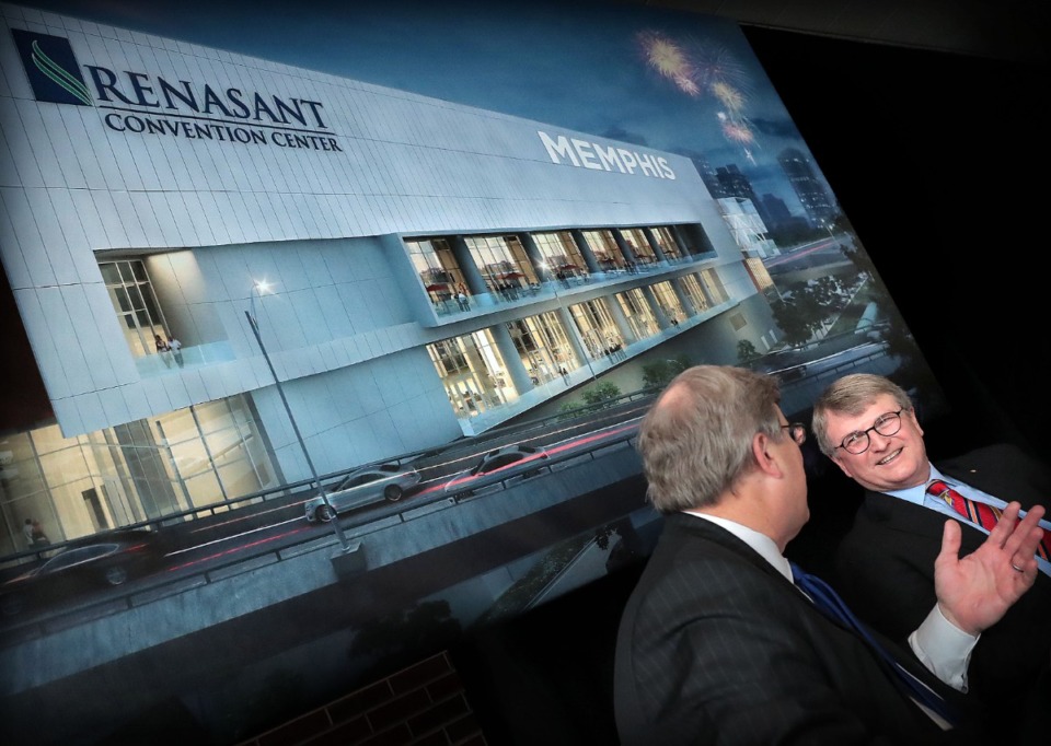 <strong>Renasant Bank CEO Mitch Waycaster (right) participates in a signing ceremony with Memphis Mayor Jim Strickland at the Cannon Center for the Performing Arts on Thursday, Nov. 21, to announce the official name change for the Downtown convention center to the Renasant Convention Center.</strong> (Jim Weber/Daily Memphian)