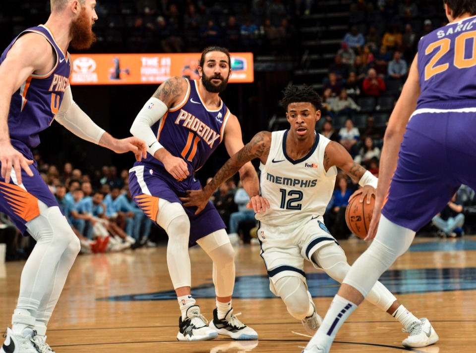 <strong>Memphis Grizzlies guard Ja Morant (12), playing against the Phoenix Suns Nov. 2, was 4 years old when LeBron James made his NBA debut.</strong> (Brandon Dill/AP)