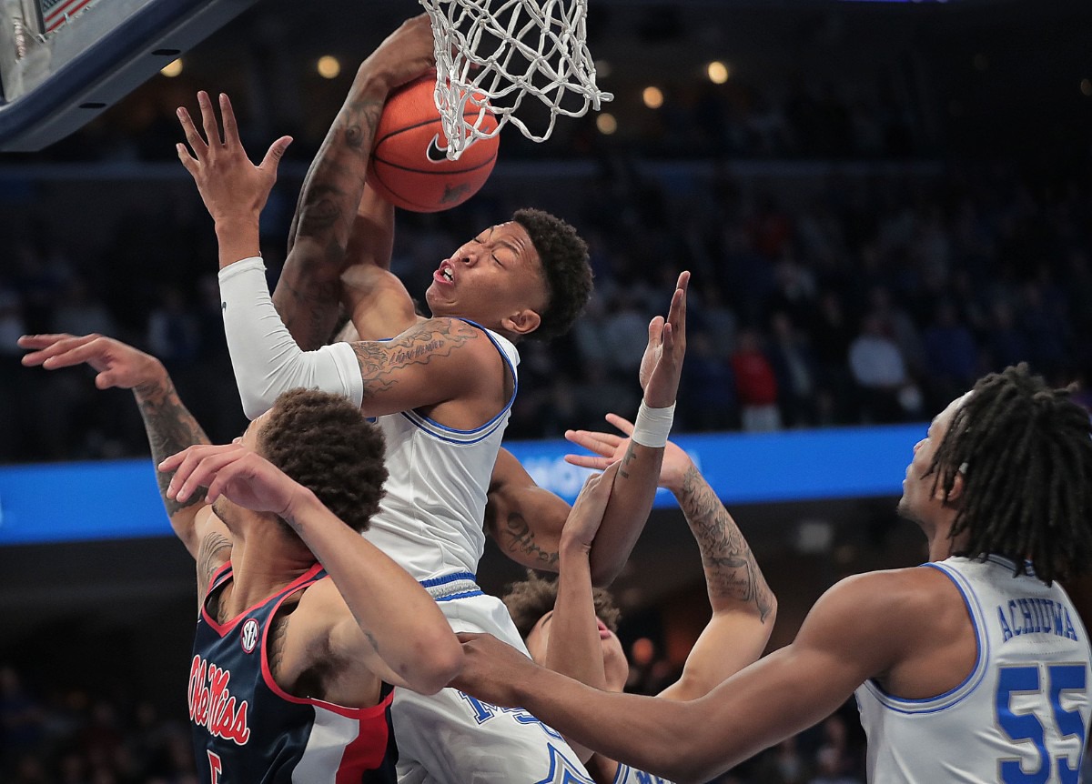 <strong>University of Memphis forward Boogie Ellis pulls down a rebound under pressure by Ole Miss during the Tigers game on Nov. 23, 2019, against the University of Mississippi at FedExForum.</strong> (Jim Weber/Daily Memphian)
