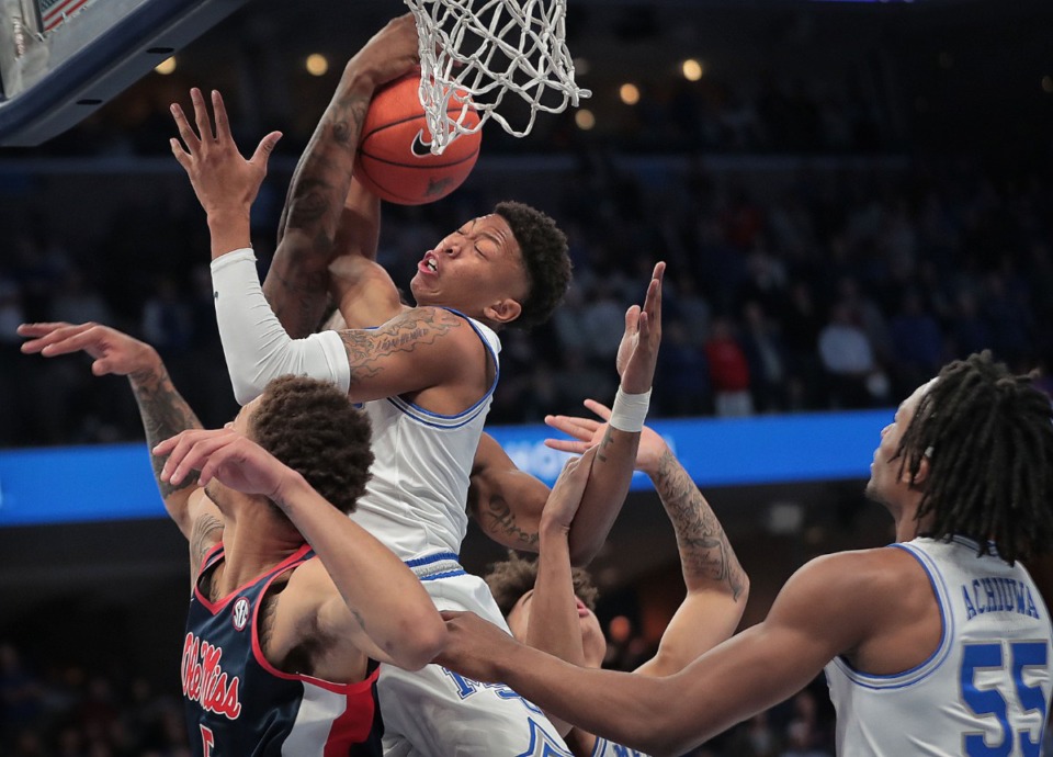 <strong>University of Memphis forward Boogie Ellis pulls down a rebound under pressure by Ole Miss during the Tigers game on Nov. 23, 2019, against the University of Mississippi at FedExForum.</strong> (Jim Weber/Daily Memphian)