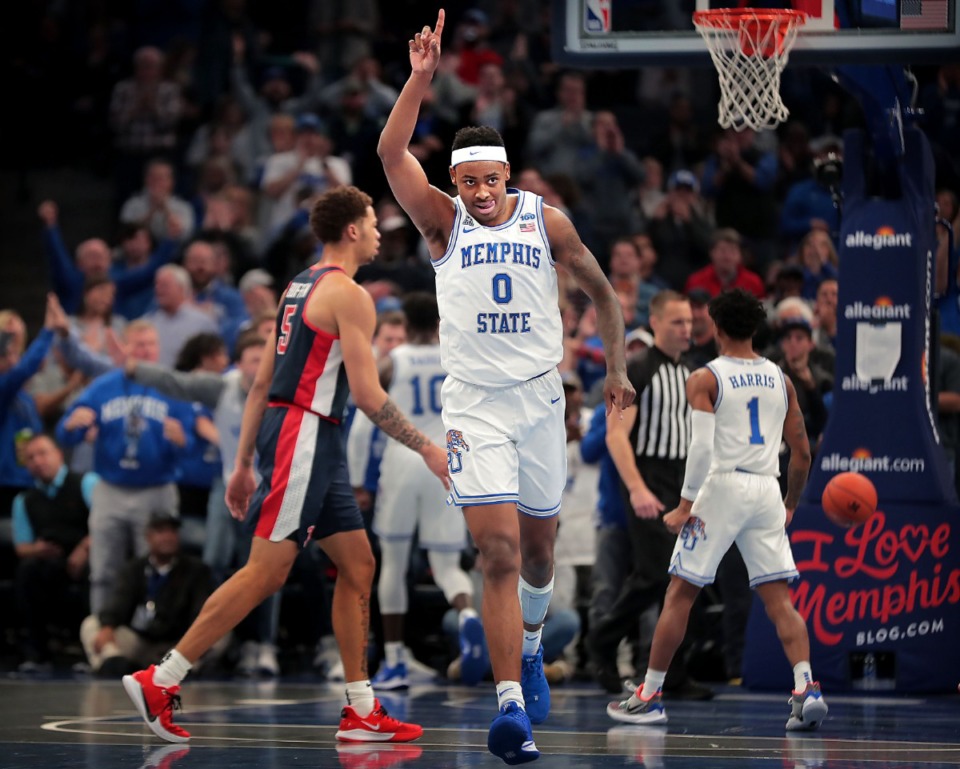 <strong>University of Memphis forward DJ Jeffries (0) celebrates after dunking against Ole Miss during the Tigers' game on Nov. 23, 2019, against Mississippi at FedExForum.</strong> (Jim Weber/Daily Memphian)