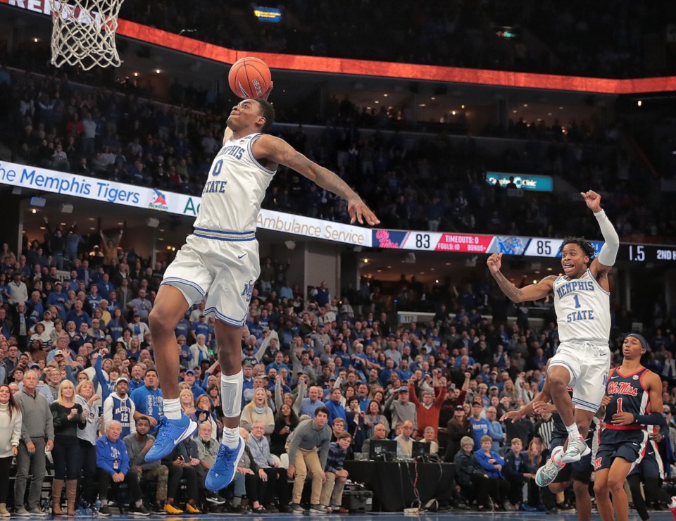 <strong>University of Memphis forward DJ Jeffries makes a breakaway dunk as Tyler Harris (1) celebrates in the final seconds of the Tigers' game on Nov. 23, 2019, against Mississippi at FedExForum.</strong> (Jim Weber/Daily Memphian)