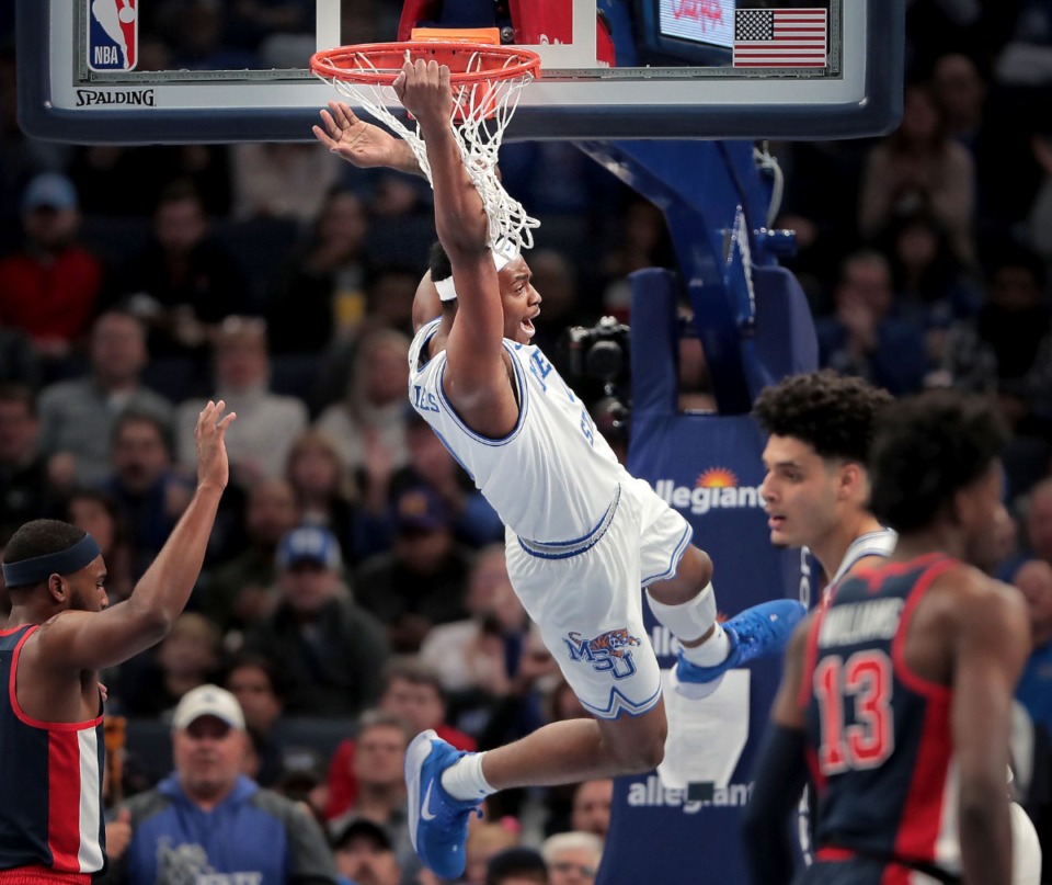 <strong>University of Memphis DJ Jeffries (0) dunks against Ole Miss during the Tigers' game on Nov. 23, 2019, against Mississippi at FedExForum.</strong> (Jim Weber/Daily Memphian)