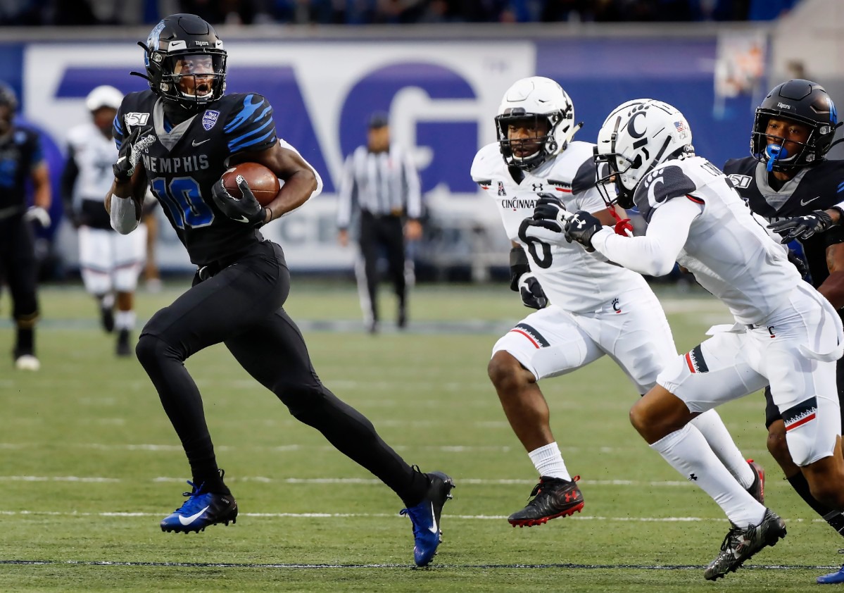 <strong>Memphis receiver Damonte Coxie (left) looks back at the Cincinnati defense after making a first down catch Nov. 29 at the Liberty Bowl Memorial Stadium.</strong> (Mark Weber/Daily Memphian)