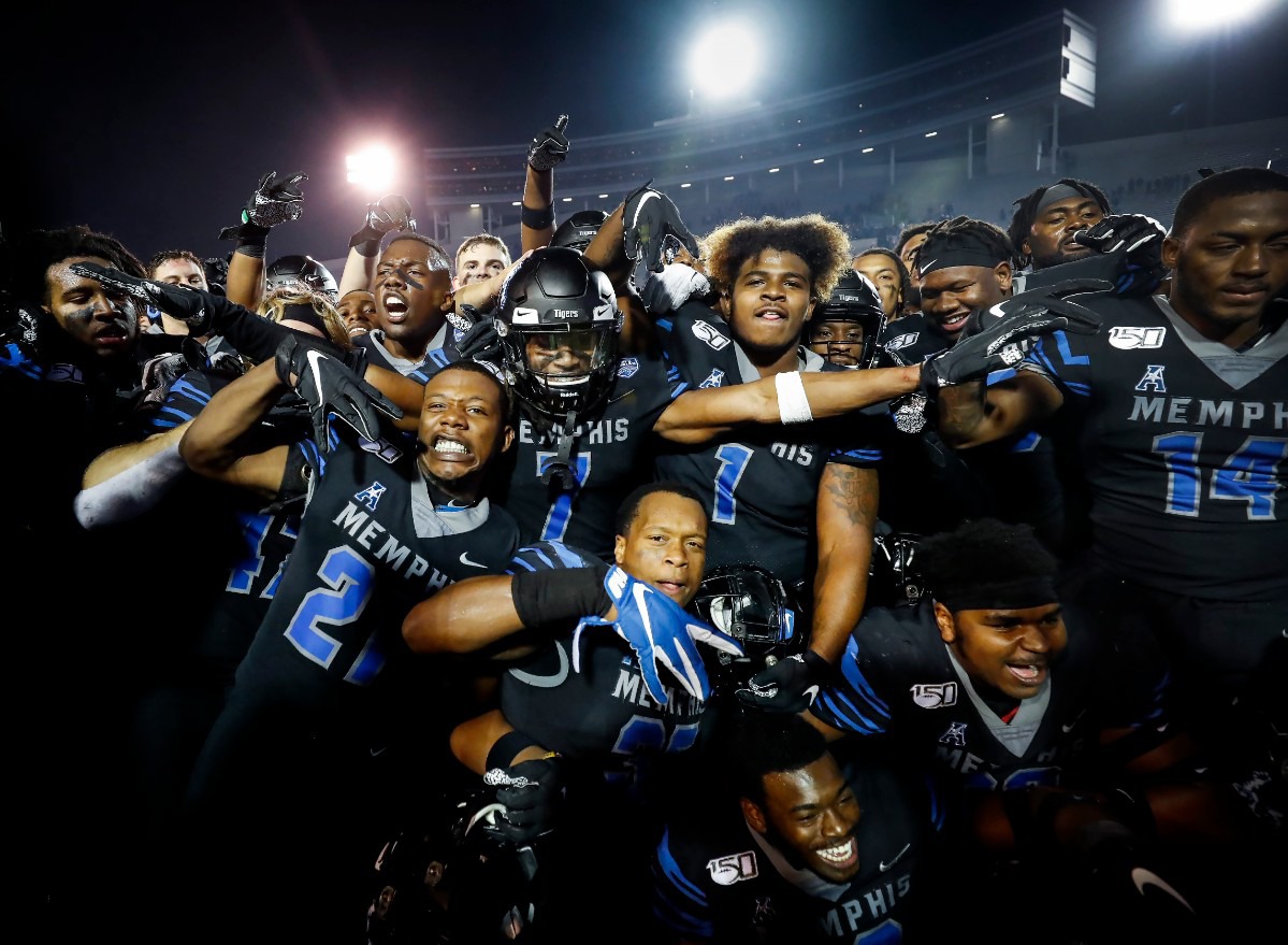<strong>Memphis teammates celebrate after defeating Cincinnati Nov. 29 at Liberty Bowl Memorial Stadium.</strong> (Mark Weber/Daily Memphian)