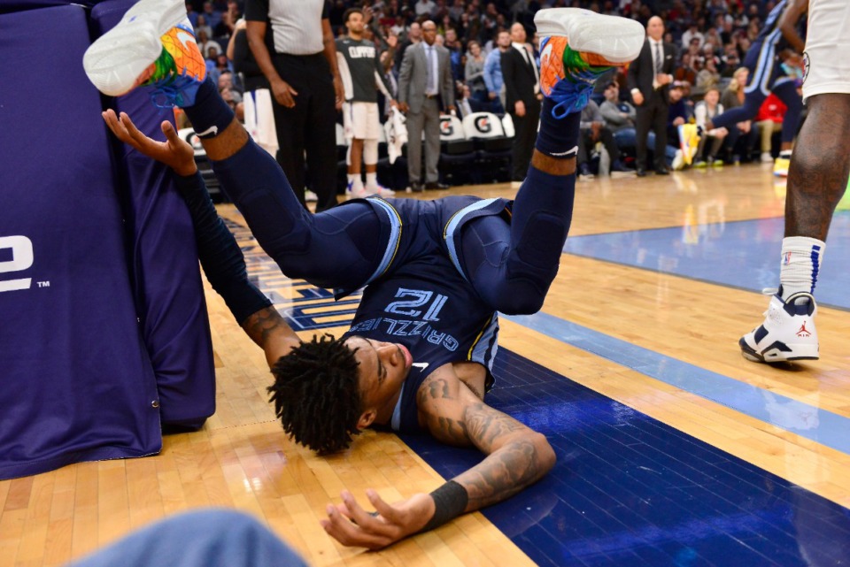 <strong>Memphis Grizzlies guard Ja Morant (12) falls to the court in the second half of an NBA basketball game against the Los Angeles Clippers Wednesday, Nov. 27, 2019, in Memphis, Tenn.</strong> (AP Photo/Brandon Dill)