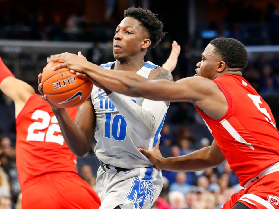 <strong>Memphis guard Damion Baugh (left0 drives the lane against Bradley defender Darrell Brown (right) during action Tuesday, Dec. 3, 2019 at the FedExForum.</strong> (Mark Weber/Daily Memphian)