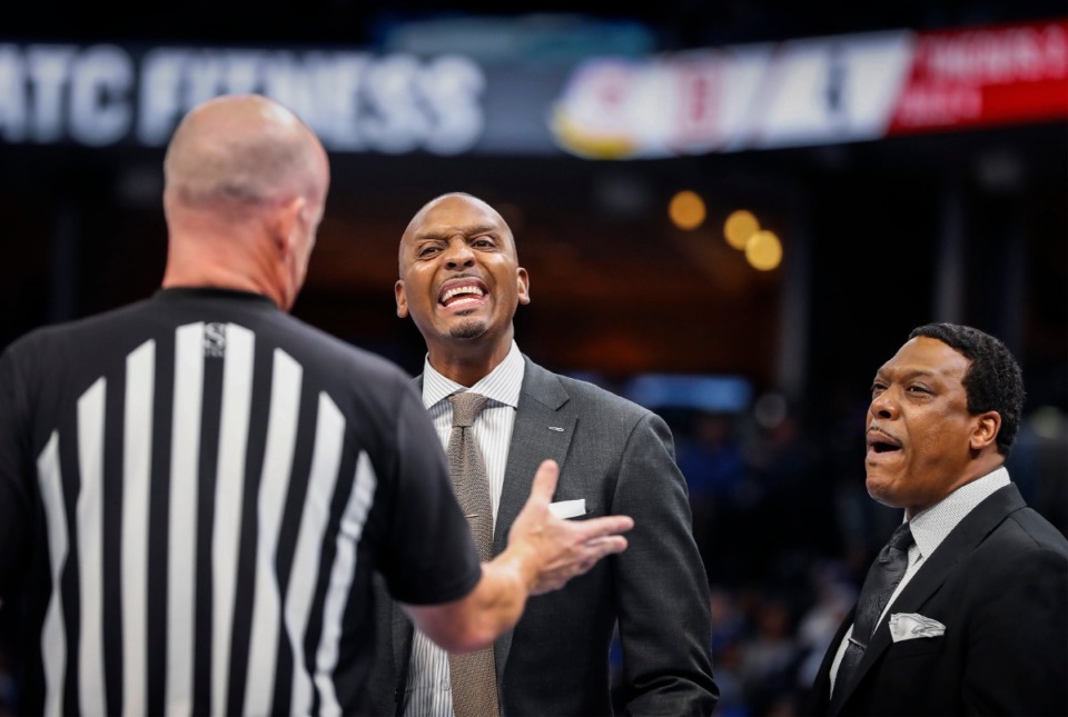 <strong>Memphis head coach Penny Hardaway (middle) and assistant coach Tony Madlock (right) argue with an official during action against Bradley Tuesday, Dec. 3, 2019 at the FedExForum.</strong> (Mark Weber/Daily Memphian)