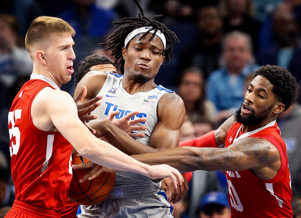 <strong>Memphis forward Precious Achiuwa (middle) battles Bradley defenders Nate Kennell (left) and Elijah Childs (right) for a rebound during action&nbsp; Dec. 3, 2019, at FedExForum.</strong> (Mark Weber/Daily Memphian)