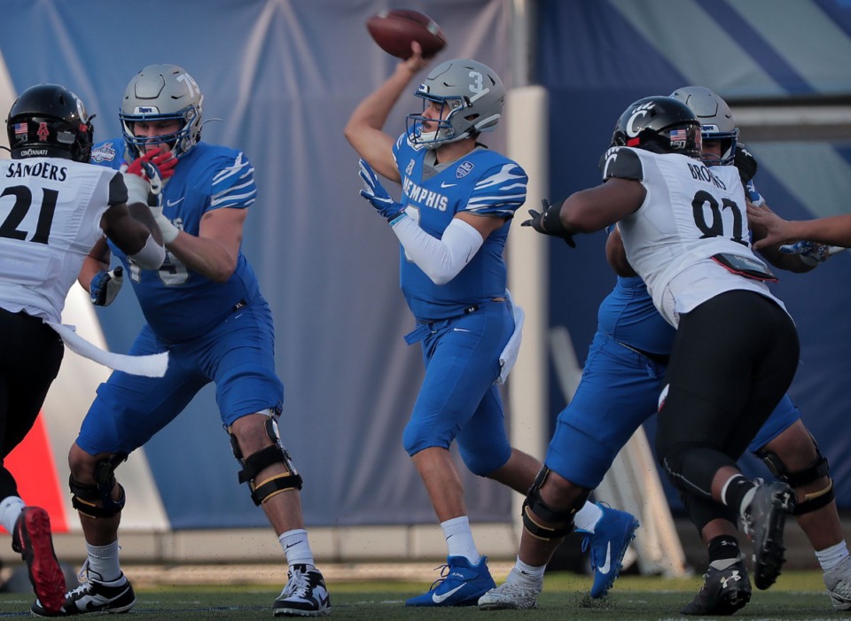 <strong>University of Memphis quarterback Brady White passes under pressure in the first half of the Tiger's AAC Championship game on Dec. 7, 2019, against the Bearcats at the Liberty Bowl Memorial Stadium.</strong> (Jim Weber/Daily Memphian)
