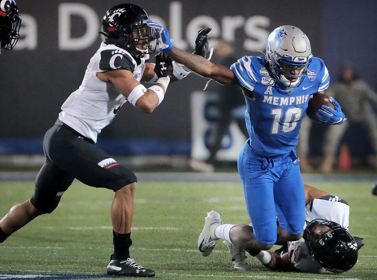 <strong>University of Memphis Damonte Coxie (10) is taken down during a run in the second half of the Tiger's AAC Championship game on Dec. 7, 2019, against the Bearcats at the Liberty Bowl Memorial Stadium.</strong> (Jim Weber/Daily Memphian)