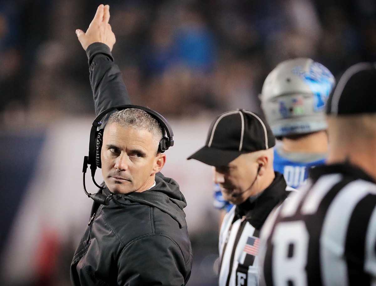 <strong>University of Memphis head coach Mike Norvell (left) reacts to a call on the field during the second half of the Tiger's AAC Championship game on Dec. 7, 2019, against the Bearcats at the Liberty Bowl Memorial Stadium.</strong> (Jim Weber/Daily Memphian)