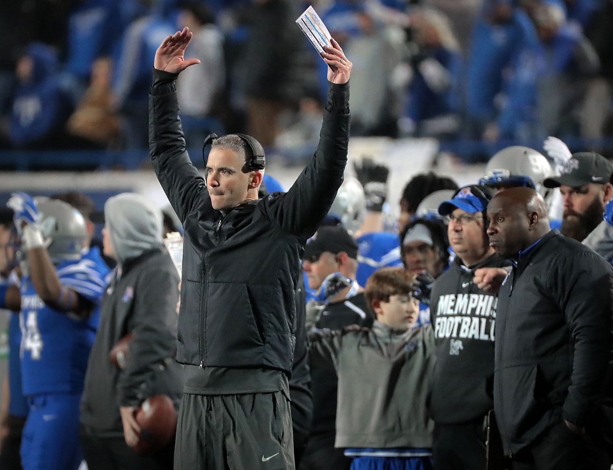 <strong>University of Memphis head coach Mike Norvell (left) reacts to a call on the field during the second half of the Tiger's AAC Championship game on Dec. 7, 2019, against the Bearcats at the Liberty Bowl Memorial Stadium.</strong> (Jim Weber/Daily Memphian)