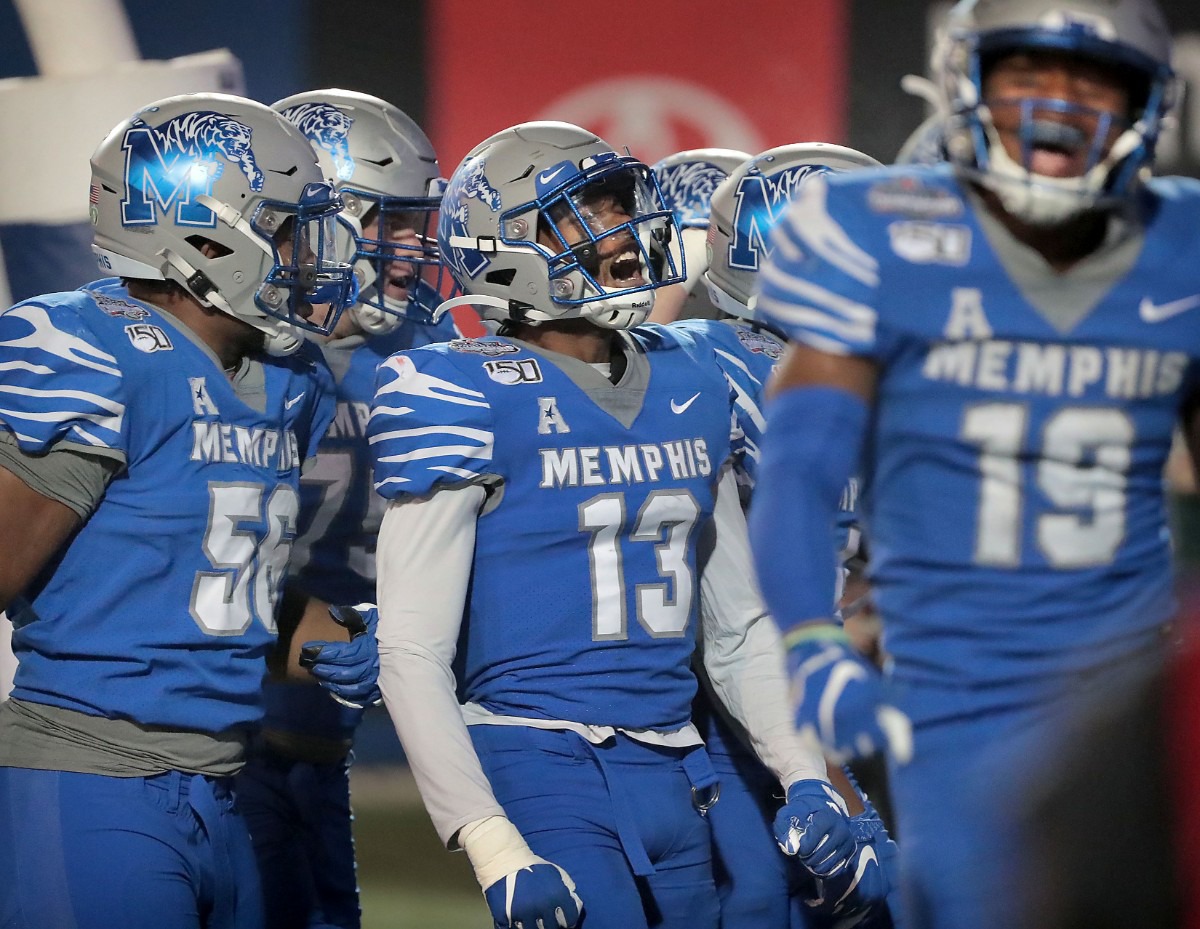 <strong>University of Memphis players celebrate after a touchdown in the second half of the Tiger's AAC Championship game on Dec. 7, 2019, against the Bearcats at the Liberty Bowl Memorial Stadium.</strong> (Jim Weber/Daily Memphian)