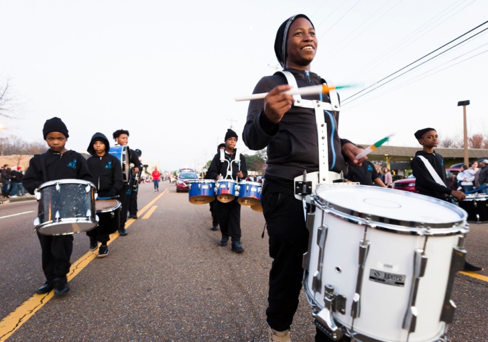 <strong>Jaqurius Burkins (right) of the Memphis Youth Arts Institution leads his drum corps during the Bartlett Christmas Parade on December 7, 2019.</strong> (Ziggy Mack/special to the Daily Memphian)