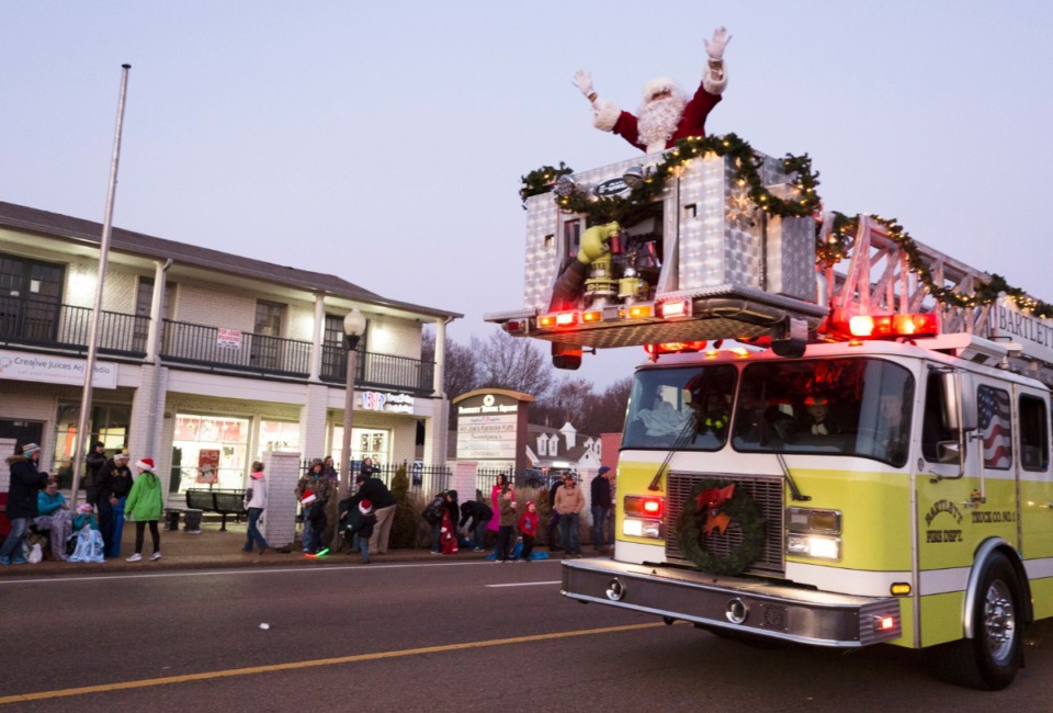 <strong>The Bartlett Fire Department gives Santa a lift to the the annual Bartlett Christmas Parade on December 7, 2019.</strong> (Ziggy Mack/special to the Daily Memphian)