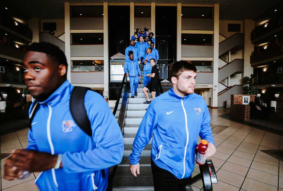 <strong>The Memphis Tigers football team concludes their morning meetings and breakfast at the University of Memphis Holiday Inn and head out to ball practice. </strong>(Houston Cofield/Daily Memphian)