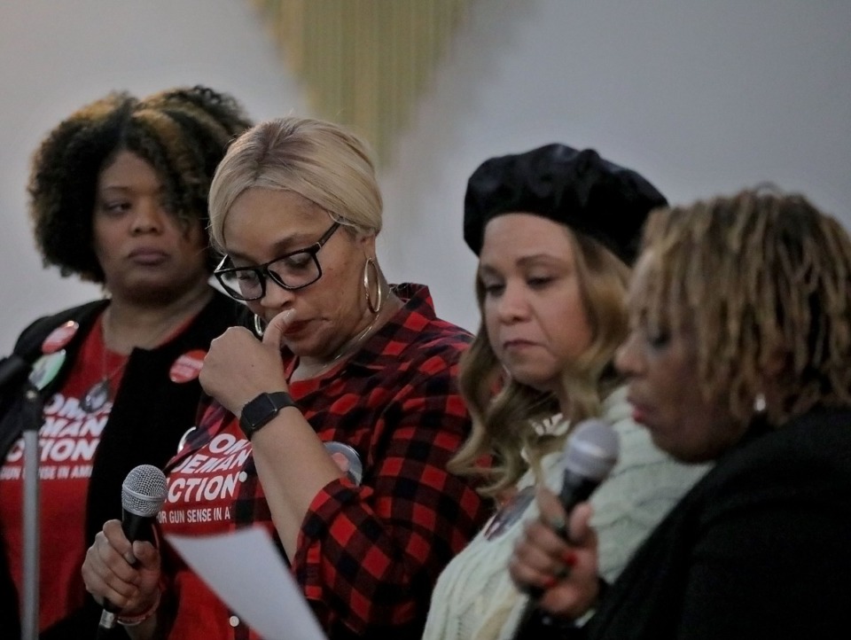 <strong>Erika Kelley (from left) Marsha Wilson, Tara Cash and JoAnn Lewis, all of whom lost a child to gun violence, share a somber moment as they each take turns reading the list of Memphians, 175 in total, who have lost their lives to gun violence so far this year at the Holy City Church of God in Christ Dec. 13, 2019.</strong> (Patrick Lantrip/Daily Memphian)