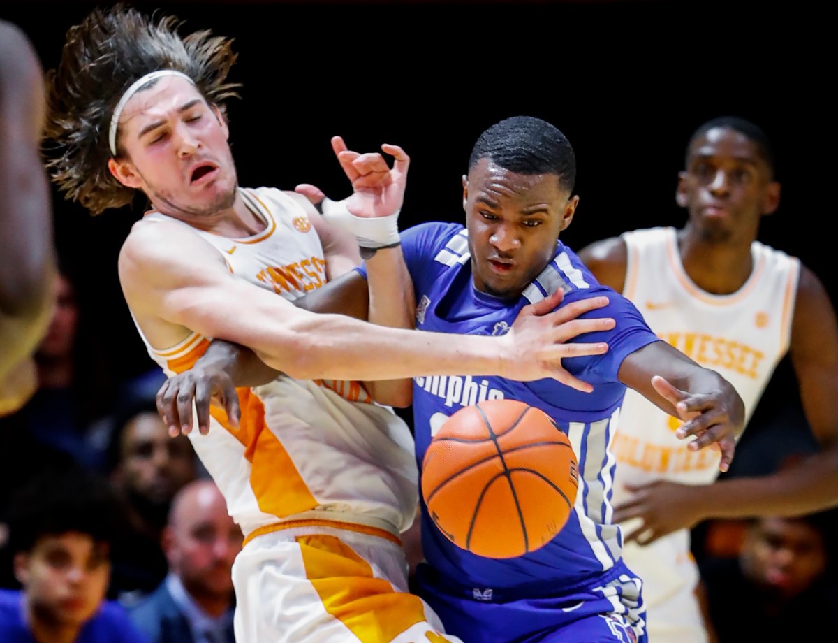 <strong>Memphis defender Alex Lomax (right) steals the ball away from Tennessee forward John Fulkerson (left) during action Saturday, Dec. 14, 2019 in Knoxville, Tennessee.</strong> (Mark Weber/Daily Memphian)