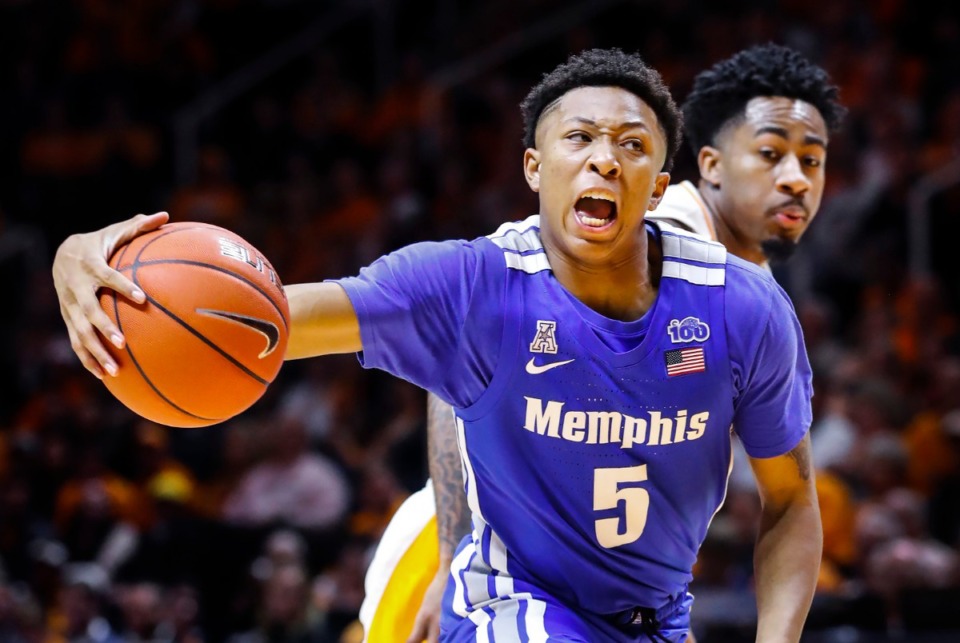 <strong>Memphis guard Boogie Ellis (front) drives the lane in front of Tennessee defender Jordan Bowden (back) during action Saturday, Dec. 14, 2019 in Knoxville, Tennessee.</strong> (Mark Weber/Daily Memphian)