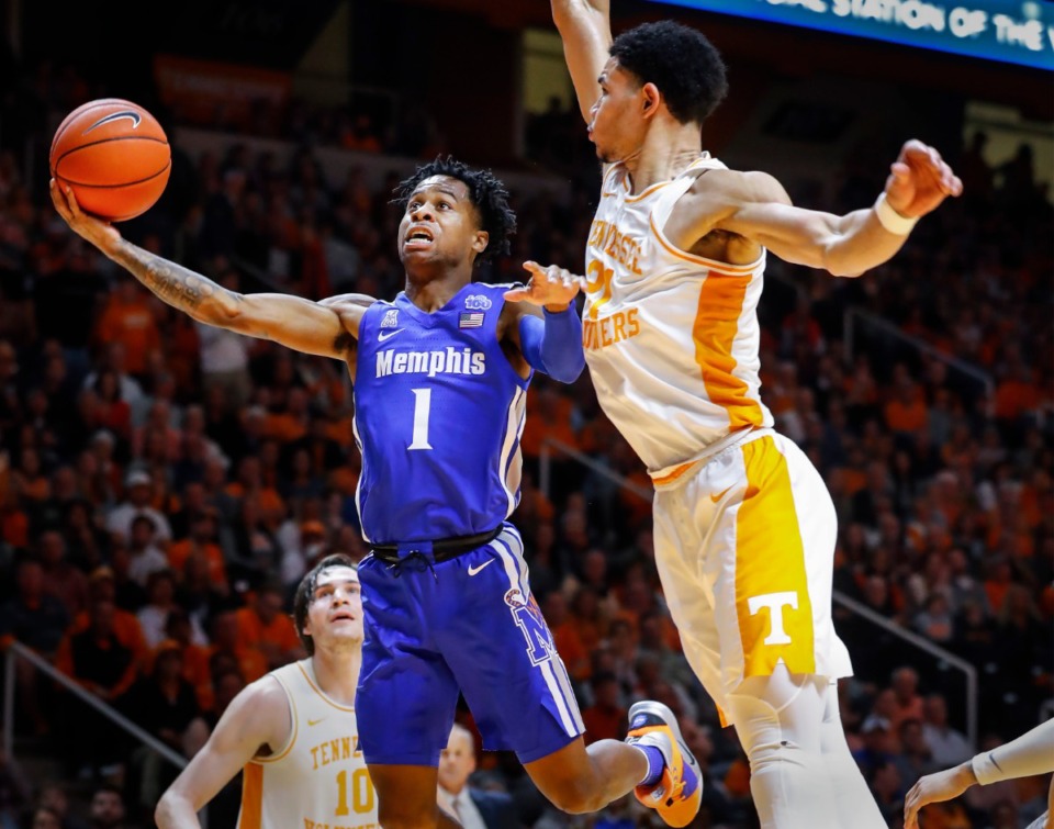 <strong>Memphis guard Tyler Harris (left) drives for a layup in front of Tennessee defender Olivier Nkamhoua (right) during action Saturday, Dec. 14, 2019 in Knoxville, Tennessee.</strong> (Mark Weber/Daily Memphian)