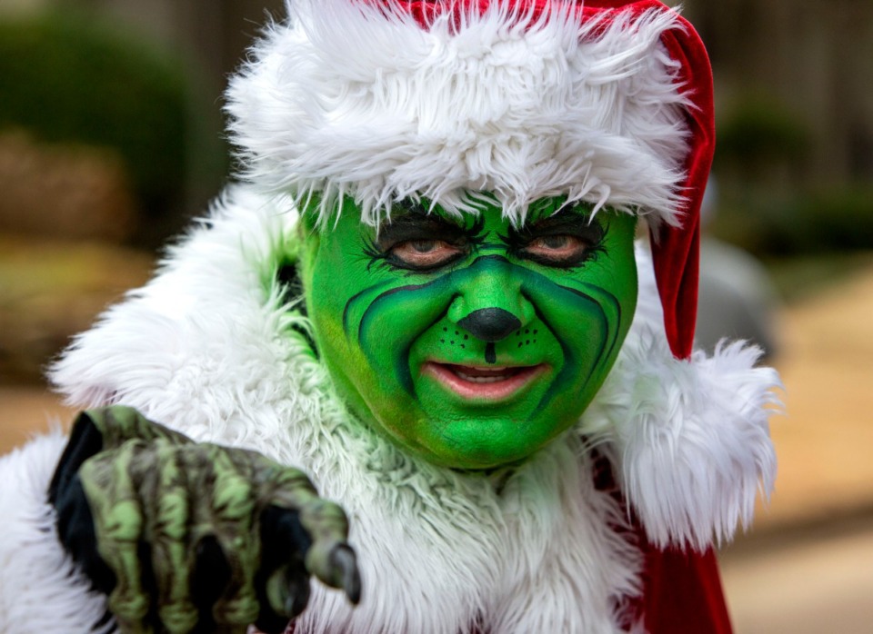 <strong>Johnnie Gross dressed as Mr. Grinch and brought his 1960 Lincoln to ride in during Germantown's Christmas parade on Dec. 14, 2019.</strong> (Mike Kerr/Special to Daily Memphian)