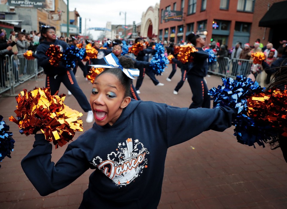 <strong>Ridgeway Middle School student Terria Smith performs with her school's dance team during the 2019 Memphis Holiday Parade on Dec. 14, 2019. The parade brought thousands to Beale Street to watch dancers, bands, floats, classic cars and Santa usher in the holiday season.</strong> (Jim Weber/Daily Memphian)