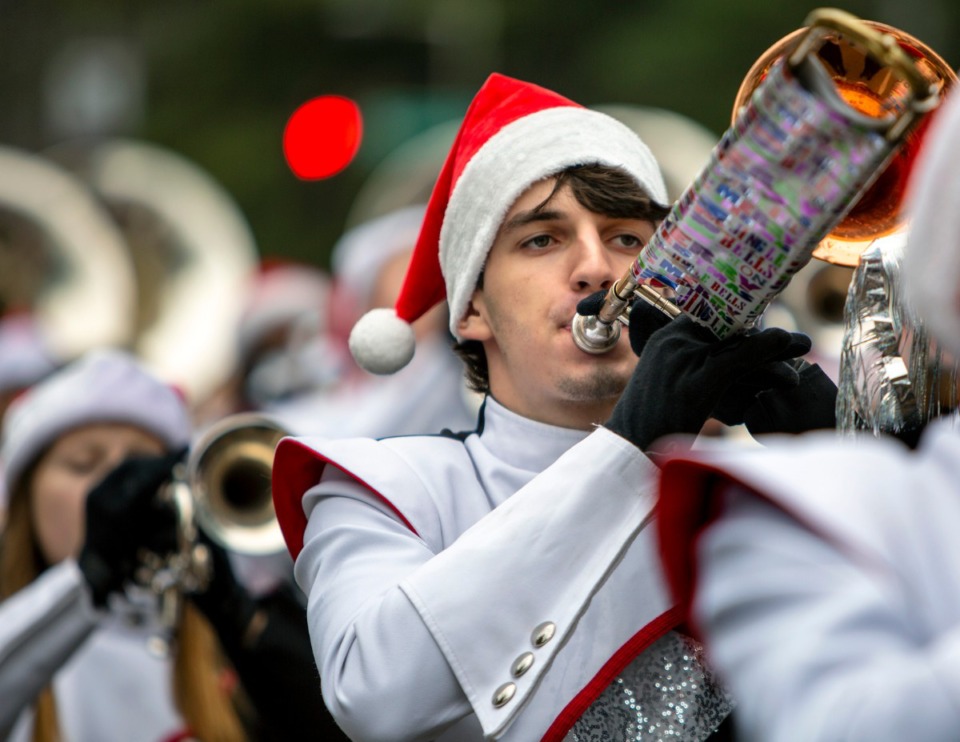 <strong>A trombone player wrapped the slide of his instrument with holiday paper to catch the mood for the Germantown Christmas parade on Dec. 14, 2019.</strong> (Mike Kerr/Special to Daily Memphian)